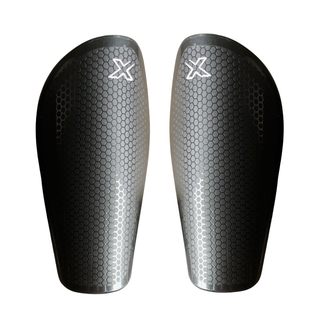 CANILLERA FUTBOL OXN SIN VELCRO NEGRO